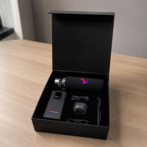Hustler corporate gift box with power bank, earbuds, glass bottle and executive pen in premium black packaging